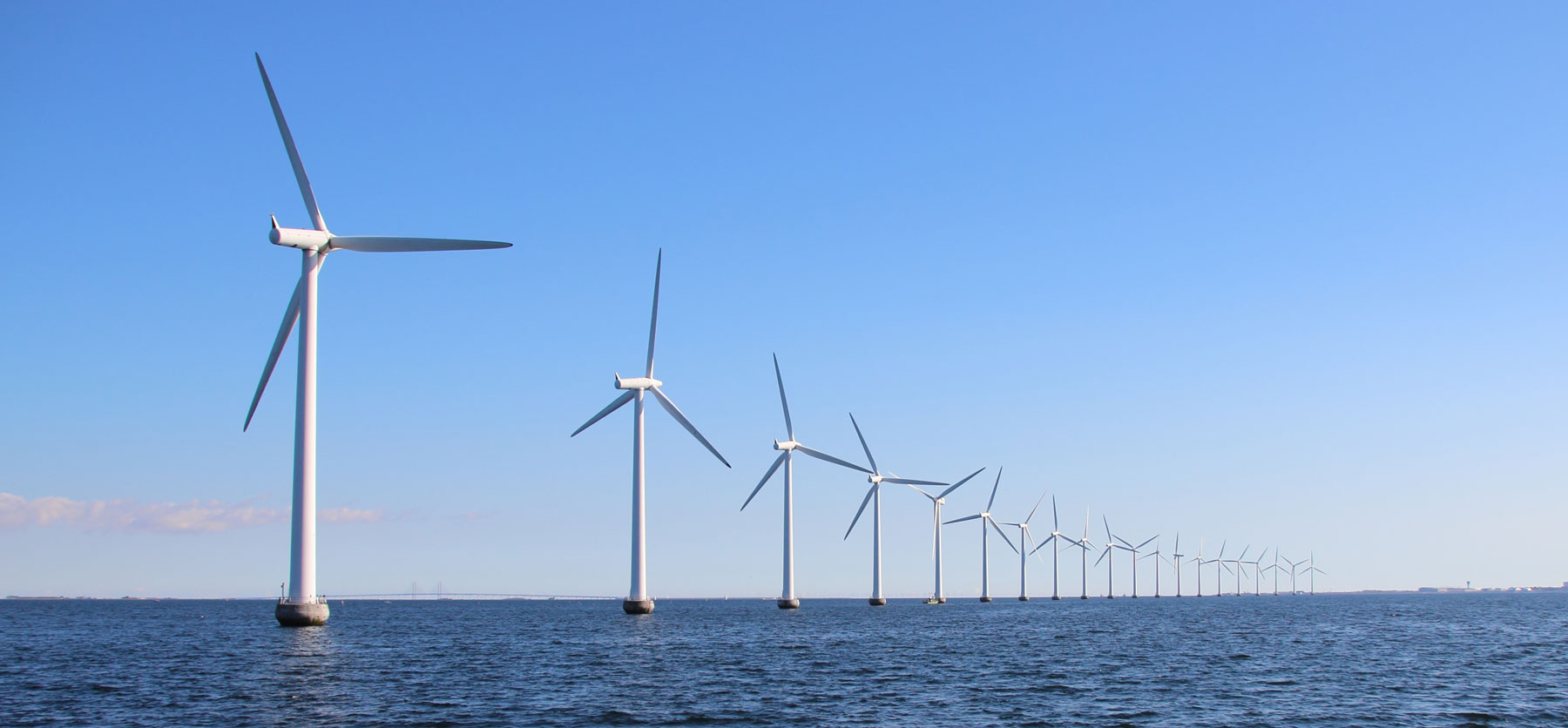 Row of wind turbines in the water