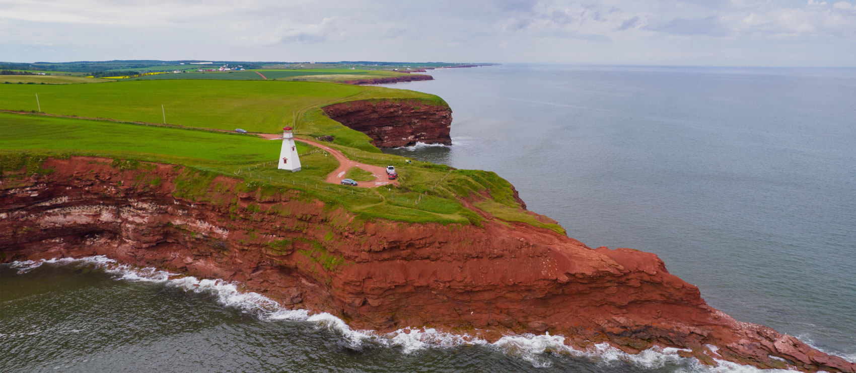 Lighthouse next to a cliff